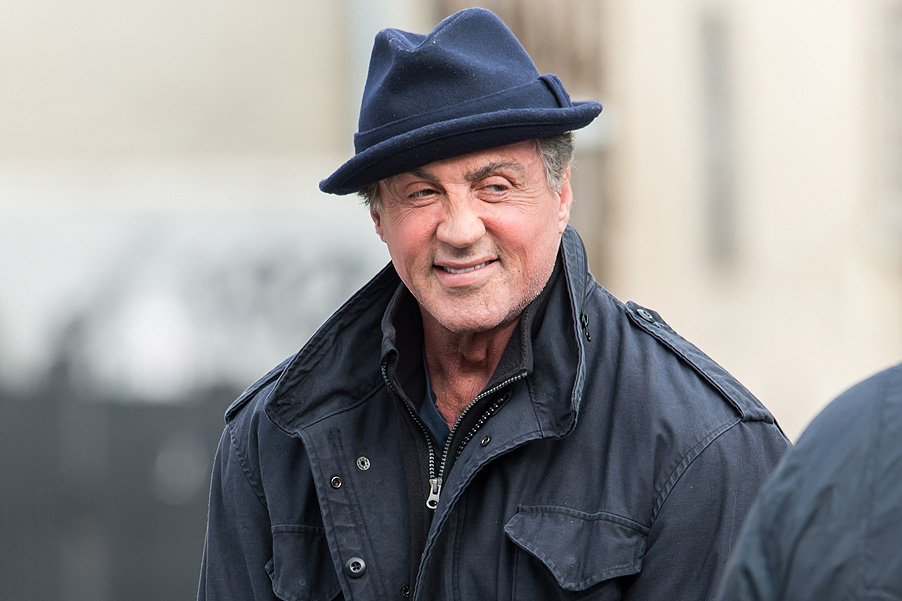 Sylvester Stallone takes time to play with a neighborhood kid on set of the new Rocky movie "Creed" in Philadelphia, PA. Pictured: Sylvester Stallone Ref: SPL944599 060215 Picture by: Gilbert Carrasquillo/Splash News Splash News and Pictures Los Angeles: 310-821-2666 New York: 212-619-2666 London: 870-934-2666 photodesk@splashnews.com 